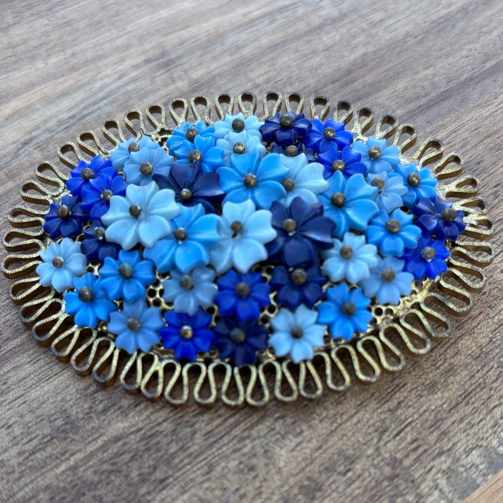 Lovely brooch with flowers in shades of blue